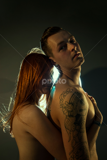 Womens naked breast with man